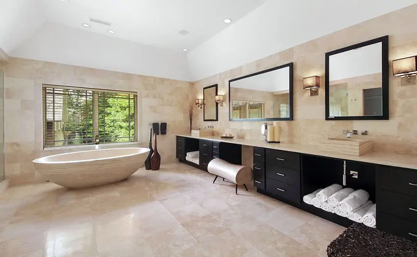 Contemporary master bathroom with travertine countertops and custom bathtub