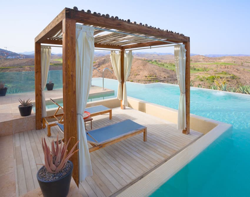 Exotic pergola lounge atop swimming pool