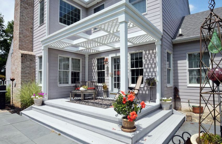 French inspired pergola with latticed cover and flower pots on the deck