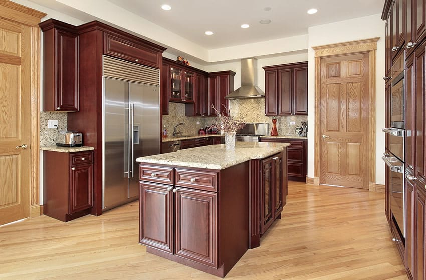Kitchen with wooden doors, counter island and recessed ceiling