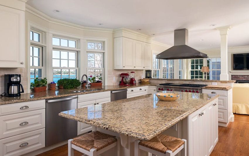 Giallo ornamental countertops, white walls and wood floor panel tiles