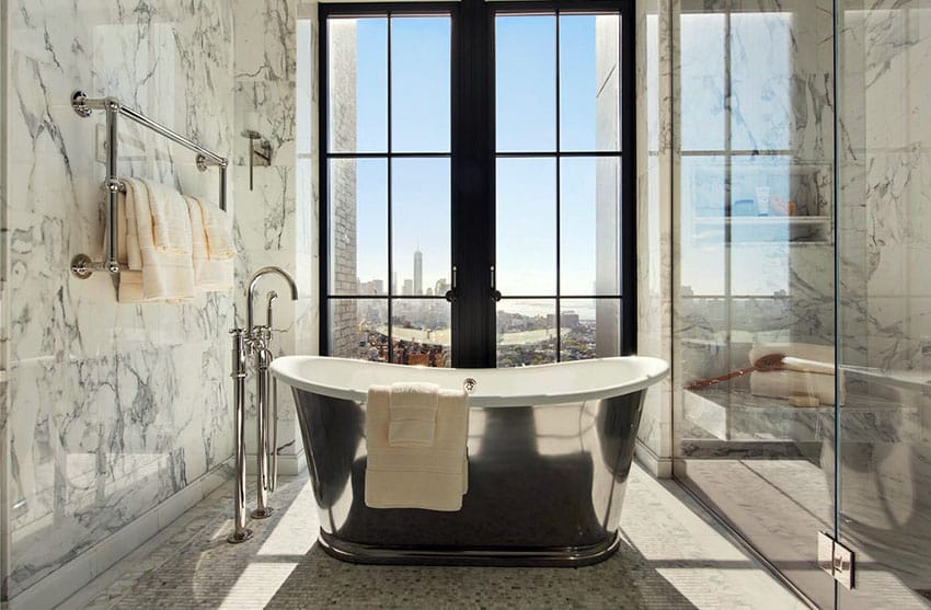 Master bathroom with stainless steel tub with city views