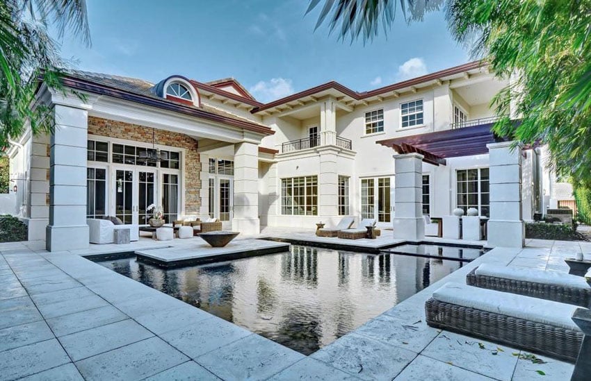 Mediterranean backyard with custom pergola