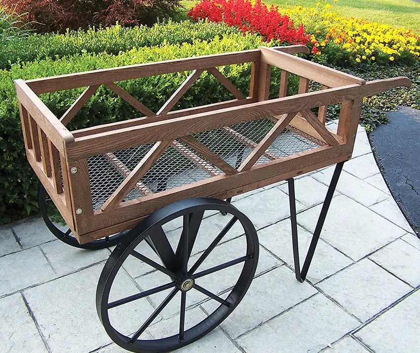 Metal and cedar wood wheelbarrow planter for decor use