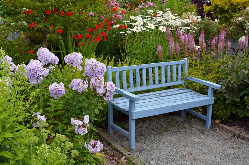 Painted baby blue bench in garden