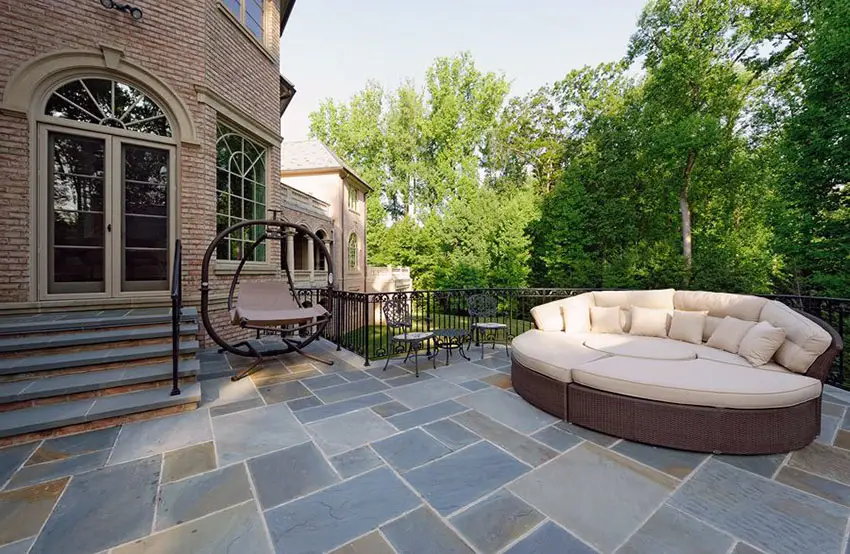 Pattern slate patio with outdoor daybed