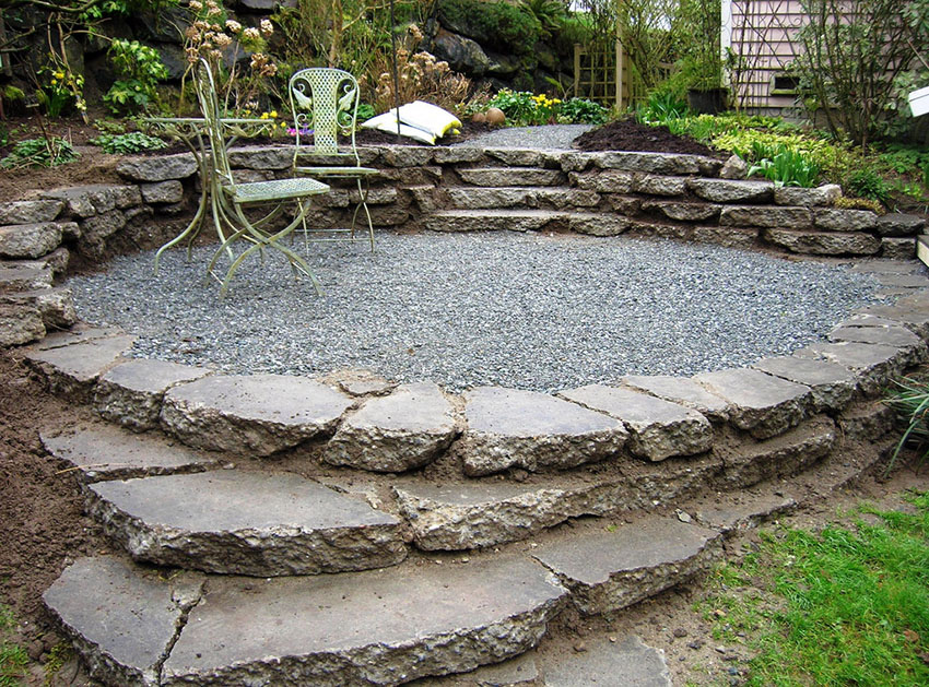 Recycled material patio with concrete and gravel