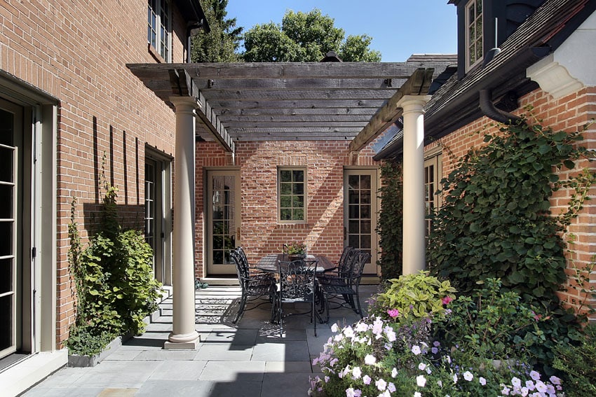 Pergola with salvaged wood trellis and concrete columns