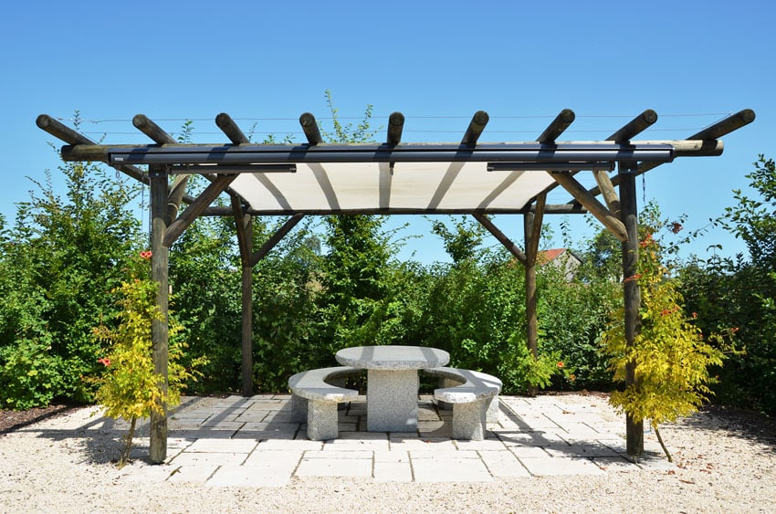 Rustic wood pergola with picnic table