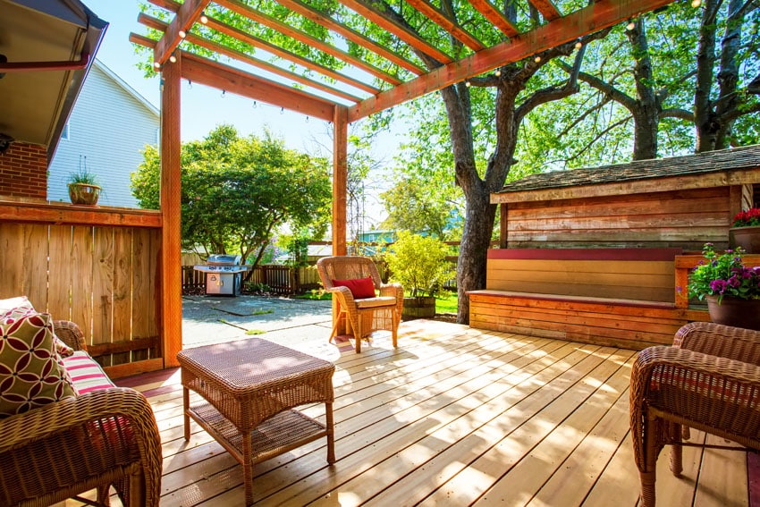 Weather treated deck with rattan furniture and fairy garden lights