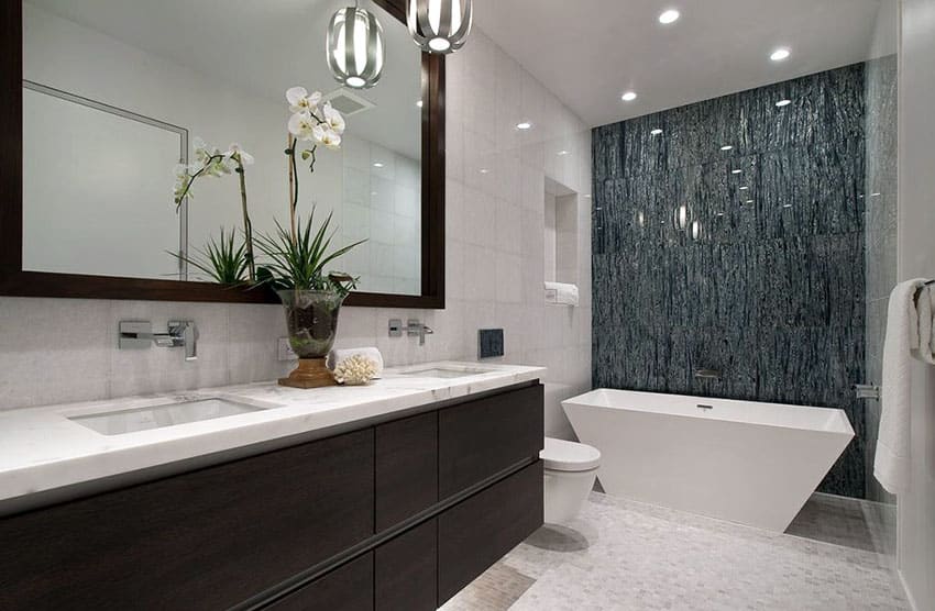 Small bathroom with white tub and high gloss wall tiles