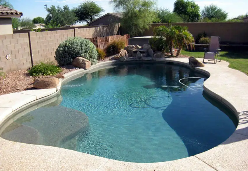 Pool with cinder block fence