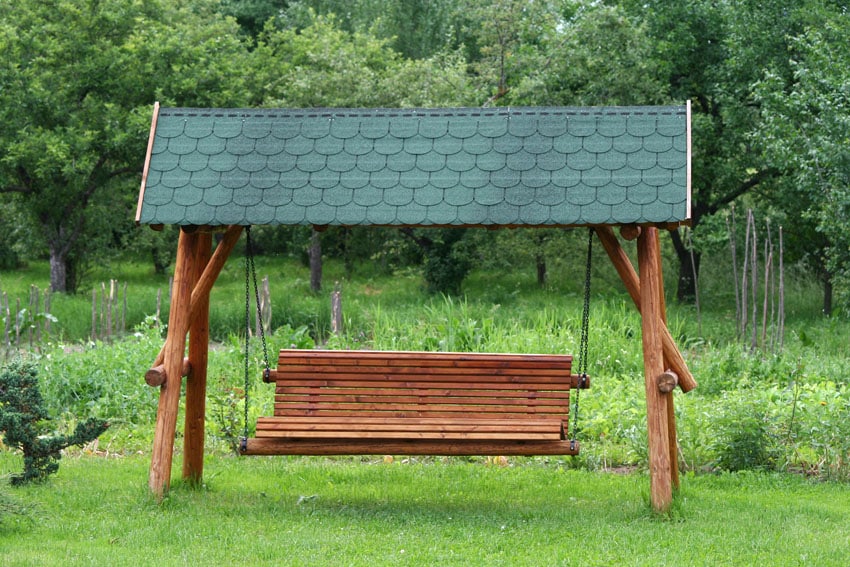 Swinging covered bench