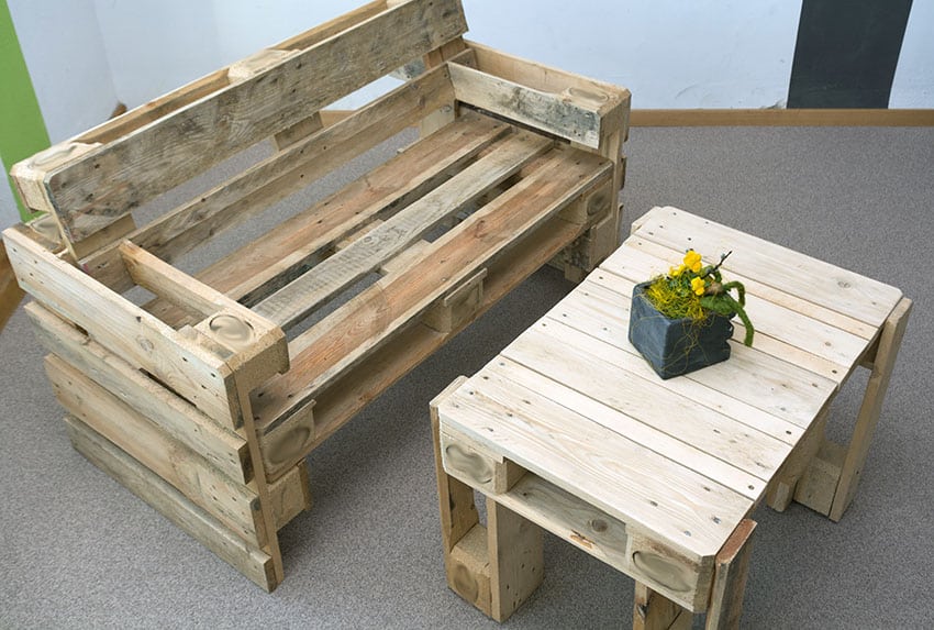 Pallet bench with yellow flowers