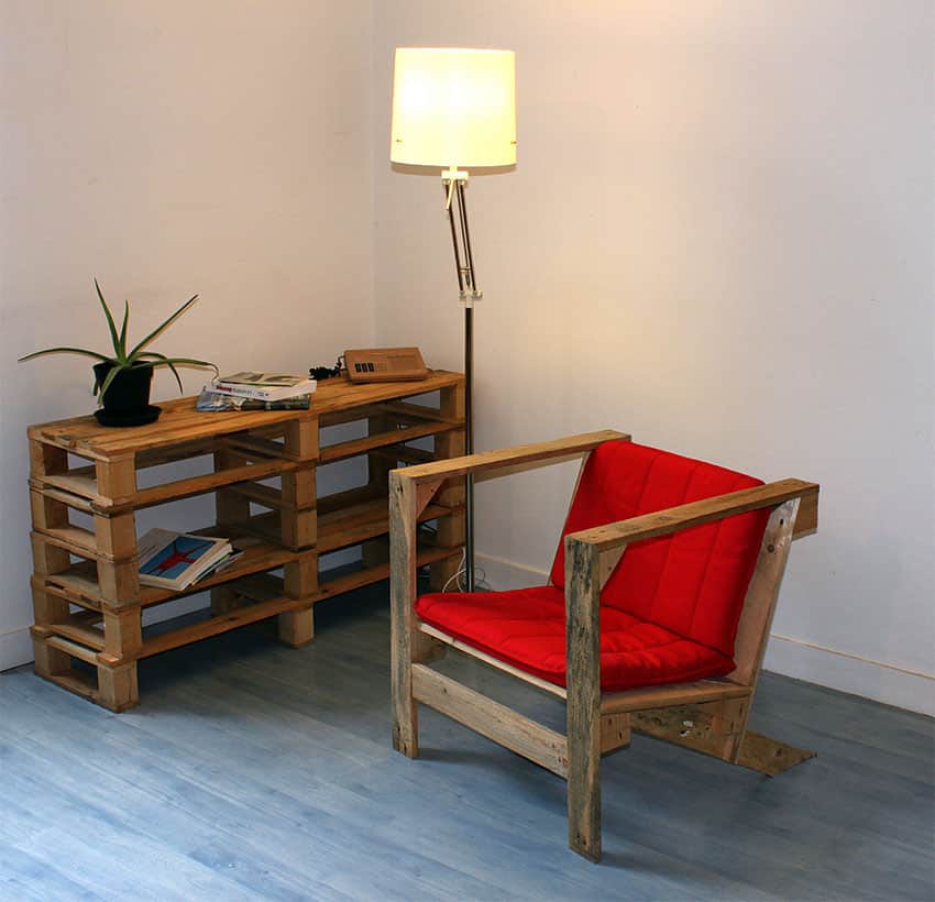 Wooden chair with red cushions and floor lamp