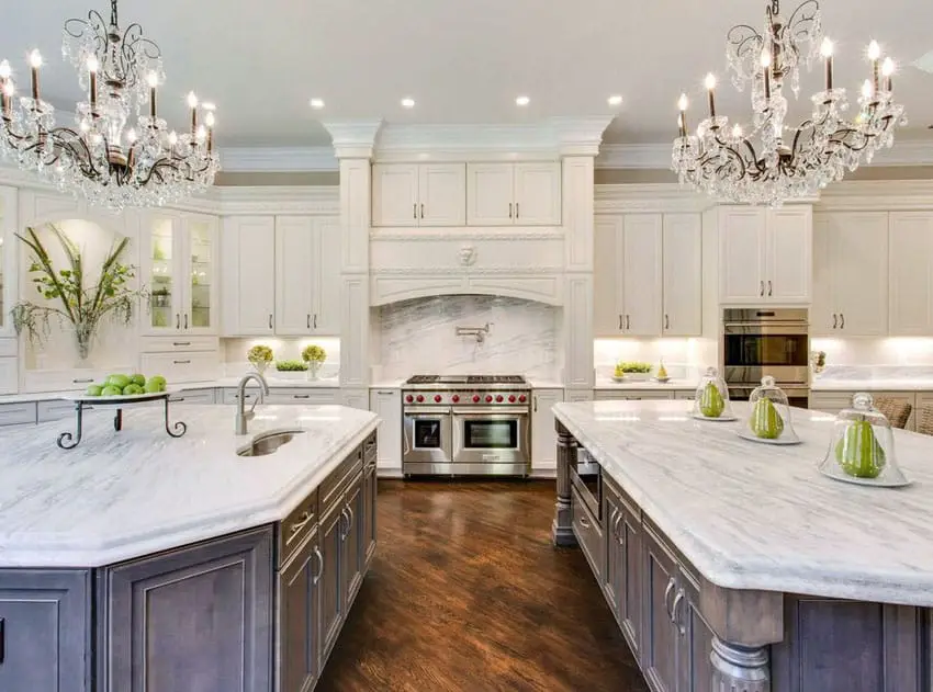 https://designingidea.com/wp-content/uploads/2017/05/beautiful-kitchen-with-white-cabinets-two-islands-two-chandeliers-and-carrara-marble-countertops.jpg.webp