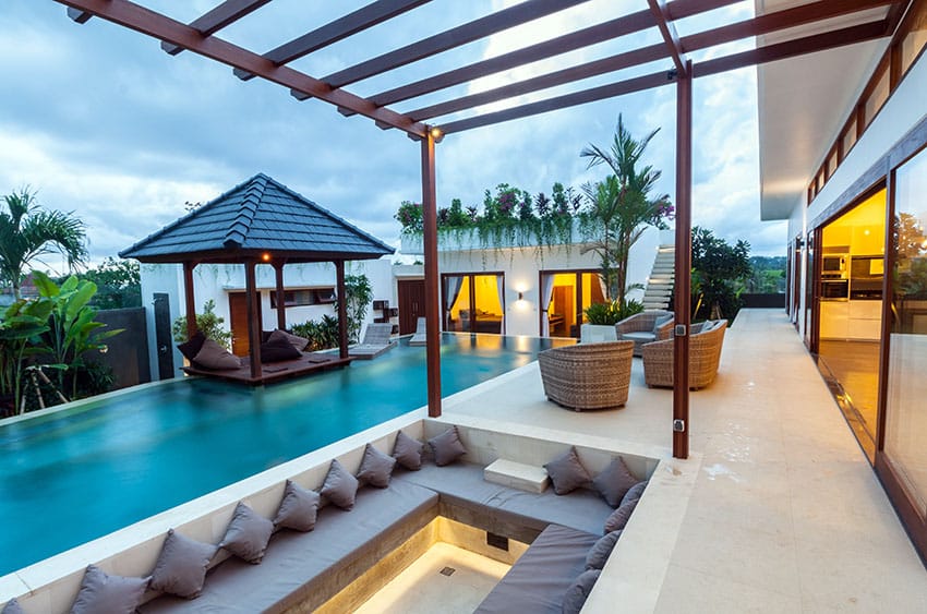 Cabana suspended above swimming pool with sunken sitting area