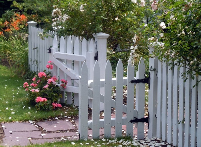 White picket garden fence with double gate