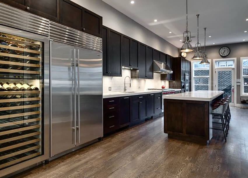 contemporary design kitchen with large wine cooler and stainless steel fridge
