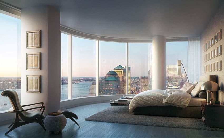 Contemporary penthouse master bedroom with city views