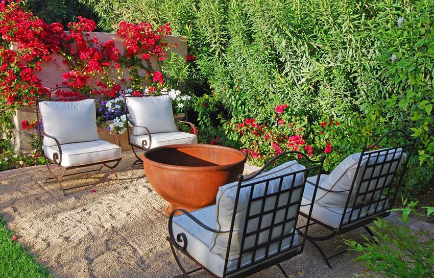 Metal outdoor chairs and large bowl-type pit