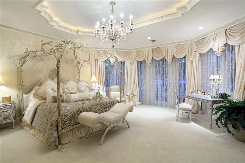 Decorative canopy bed with tray ceiling and chandelier