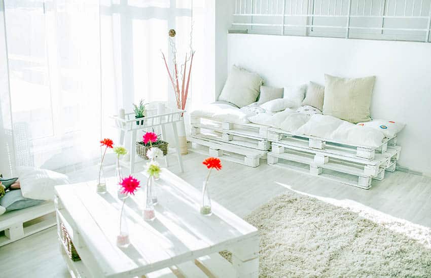 DIY white pallet daybed with cushions and table