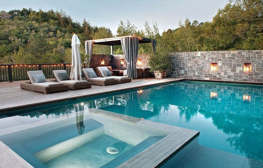 Luxury swimming pool with cabana and lounge chairs