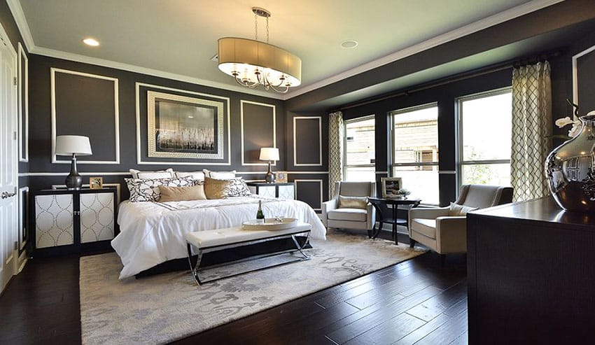 Master bedroom with blackened hickory hardwood floors and black and white color palette