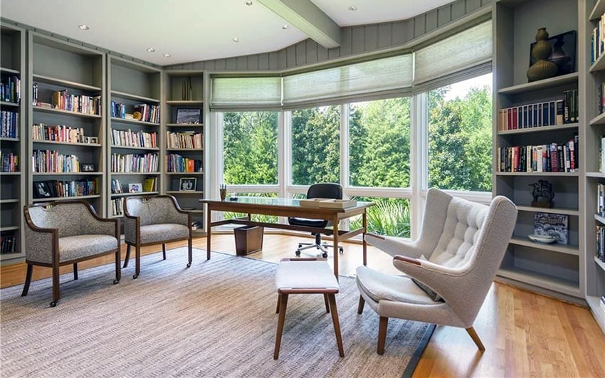 Open office space with book shelving and large windows