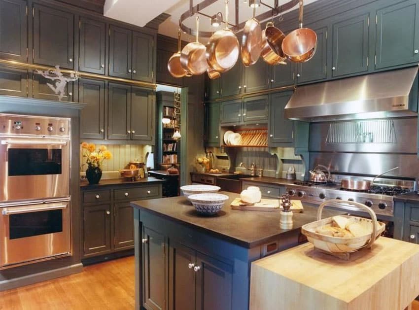 Small country kitchen with high end appliances and butcher block table