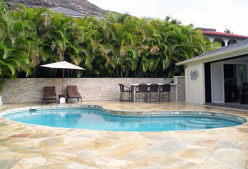Fence with quartz ledger panel wall for pools