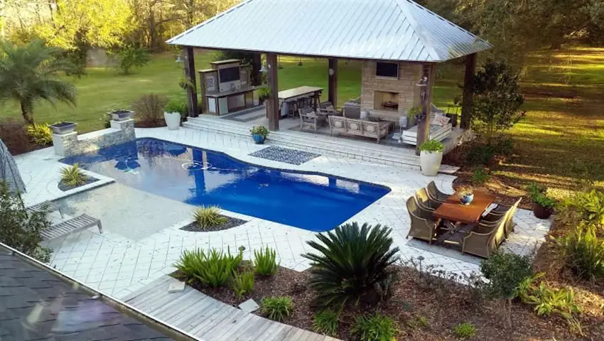 Swimming pool with large cabana with outdoor kitchen wet bar fireplace and outdoor entertainment center