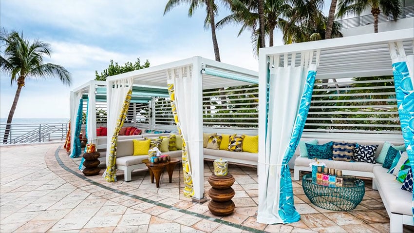 Tropical cabanas with canopy curtains