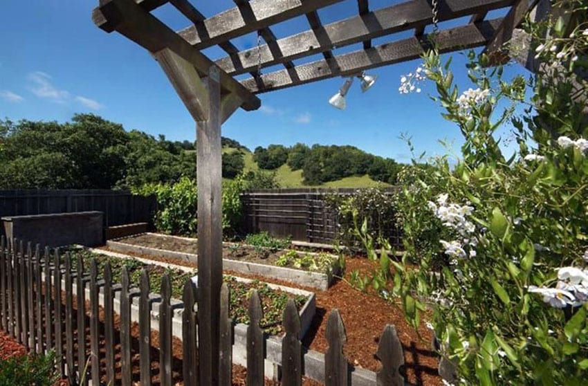 Wood garden with fence and small pergola