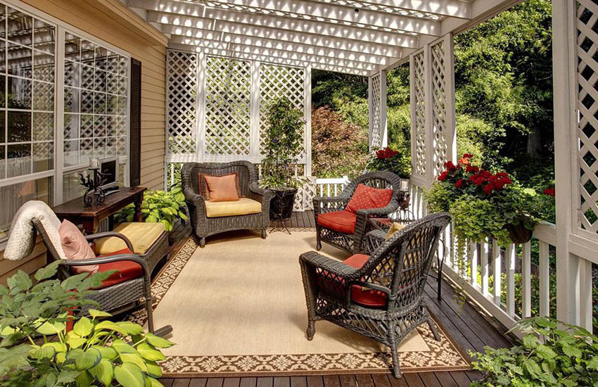 Backyard deck with white lattice fence panels and shade ceiling