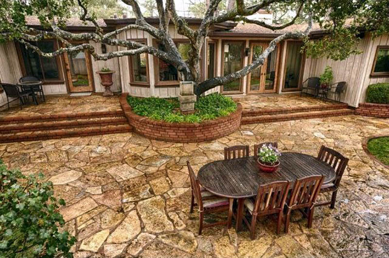 Backyard flagstone patio with outdoor dining table