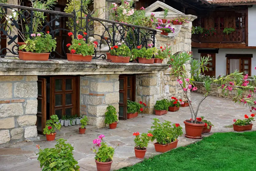 Beautiful villa backyard with patio and balcony with flower boxes