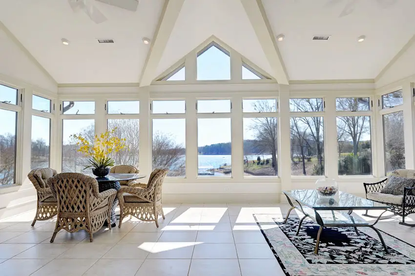 Bright room with wraparound windows and lake views