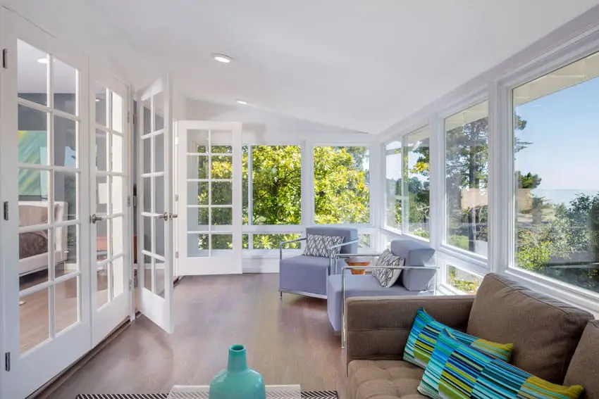 Bright sunroom design with doors and great views