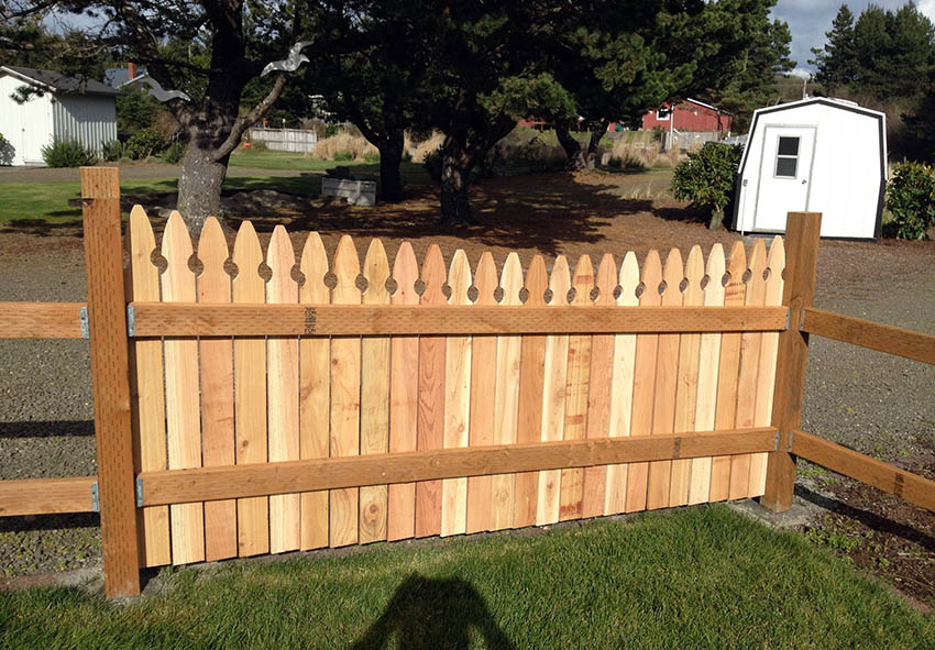 Cedar picket fence with pressure treated posts