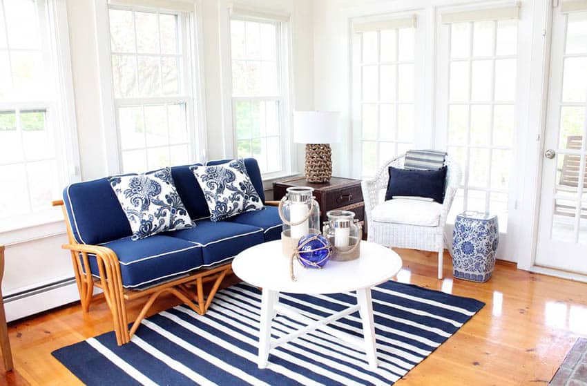 Coastal style sunroom with blue and white furniture