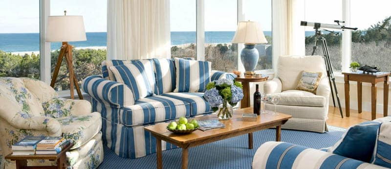Coastal style sunroom with blue and white sofas
