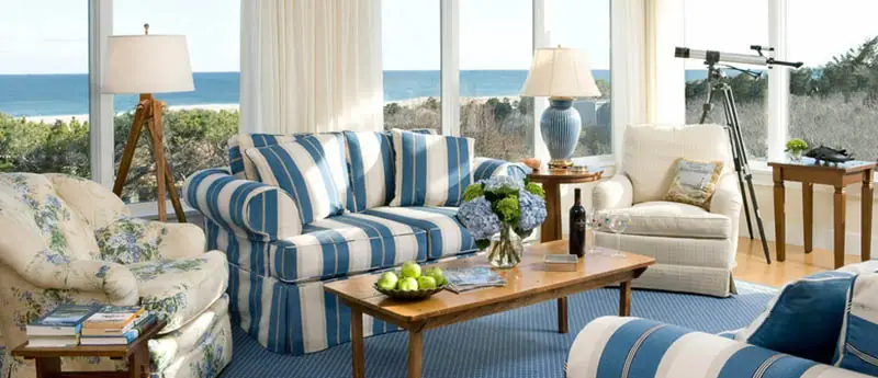 Room with blue and white sofas