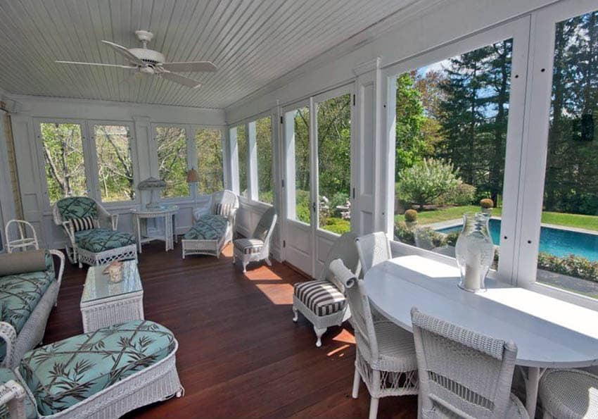 Cottage style sunroom addition with wood floors and wood slat ceiling