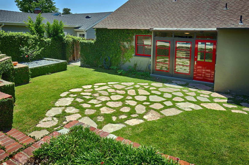 DIY flagstone and grass patio in backyard