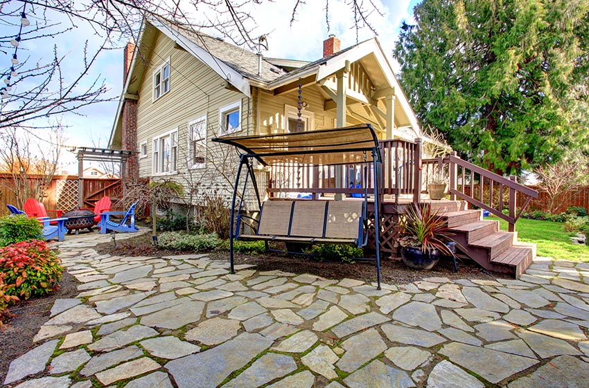 Slate flagstones in patio with swing chair