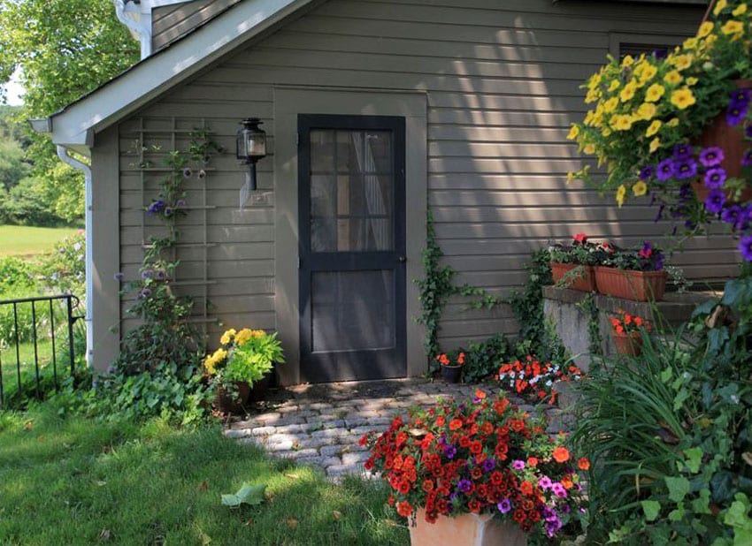 Front door to cottage with portable flower box