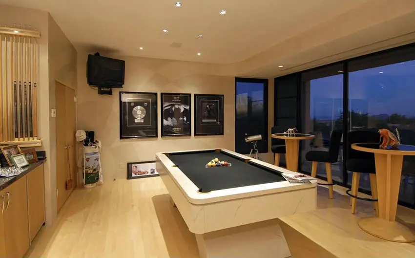 Game room with pool table, tinted windows and table 