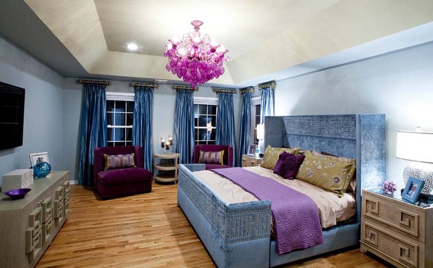 Glam style bedroom with panel bed and purple chandelier